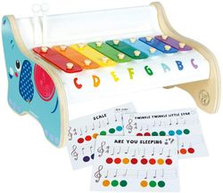 Xilófono de madera con partituras