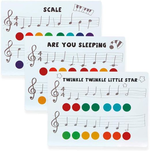 Xilófono de madera con partituras